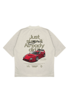 Beige t-shirt with a red sports car graphic and text on the back, on a white background