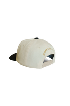 Beige cap with black visor 