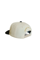 Beige cap with black visor