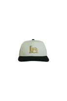 White cap with black brim and gold logo 