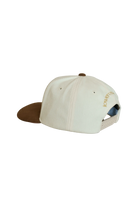 Baseball cap with brown visor and beige body 